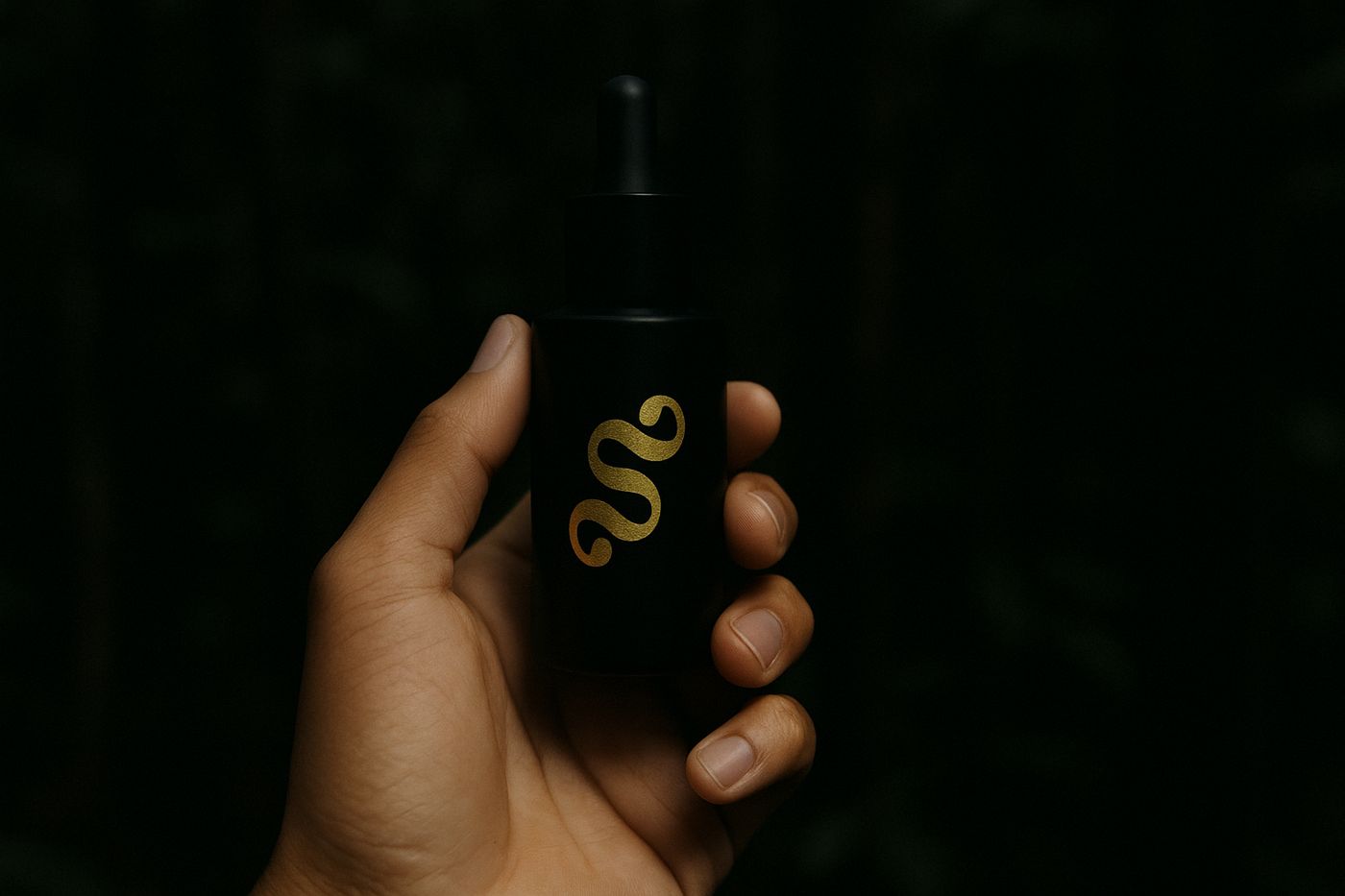 Sympathya Rainforest Hair Elixir held in the forest at night